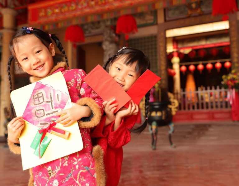 Two girls wearing cheongsam make a New Year’s visit.