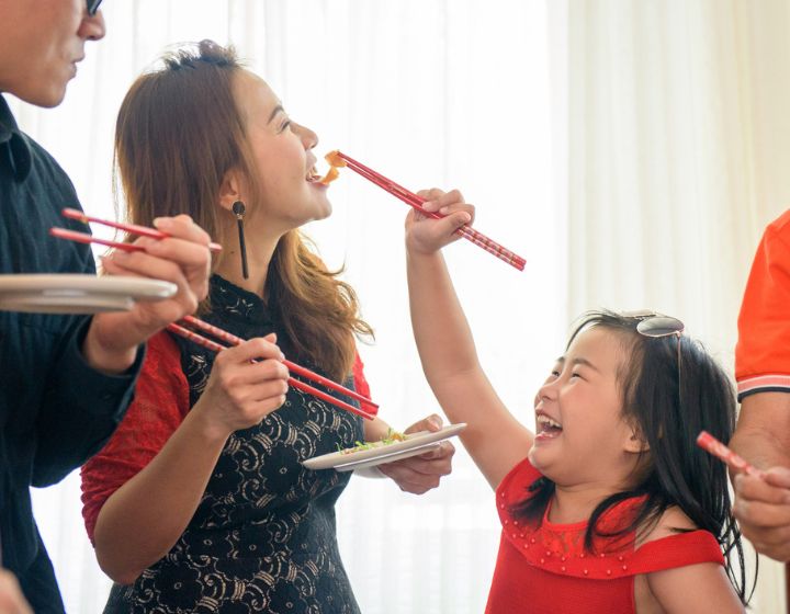 Daughter feeding food to mum in CNU reunion